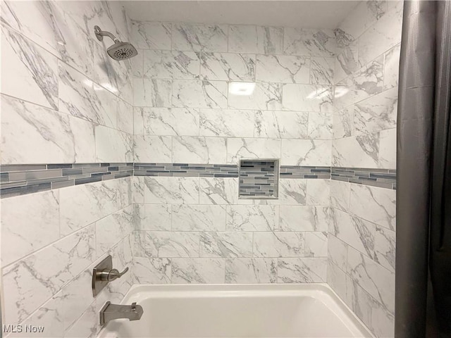 bathroom featuring bathing tub / shower combination