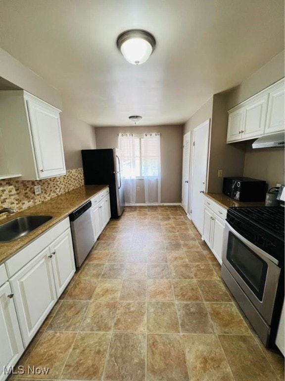 kitchen featuring a sink, appliances with stainless steel finishes, white cabinets, and under cabinet range hood