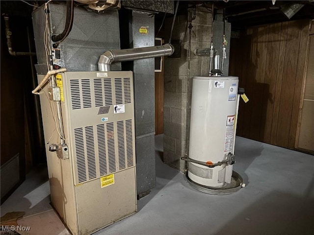 utility room with water heater and heating unit