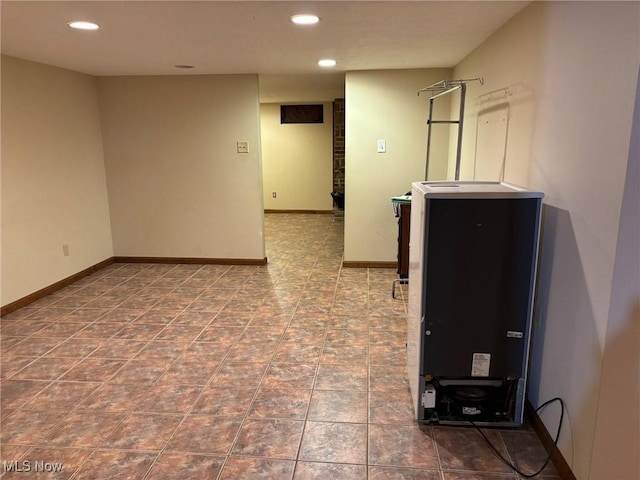 interior space with recessed lighting and baseboards