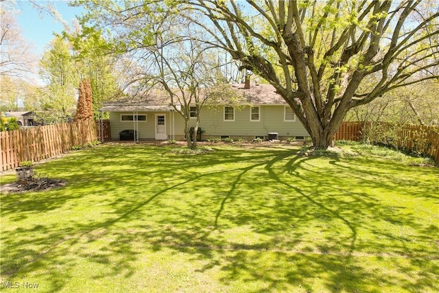 view of yard with a fenced backyard