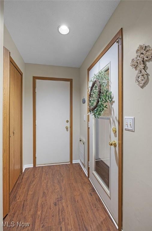 25078 Mill River Rd, Olmsted Falls, OH 44138 - doorway featuring wood finished floors and baseboards