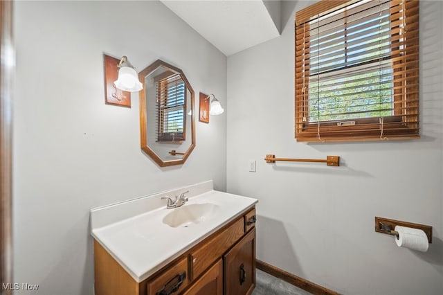 bathroom with vanity and baseboards