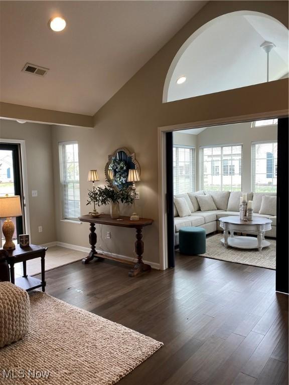 living room featuring baseboards, dark wood-type flooring, recessed lighting, and visible vents