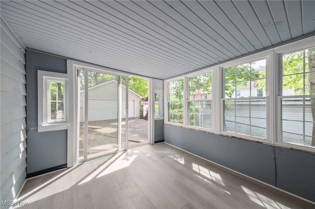 unfurnished sunroom featuring a wealth of natural light