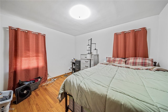 bedroom featuring wood finished floors