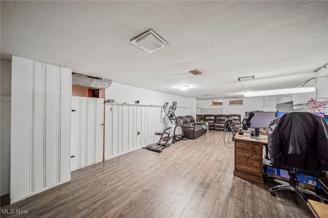office area featuring a textured ceiling and wood finished floors