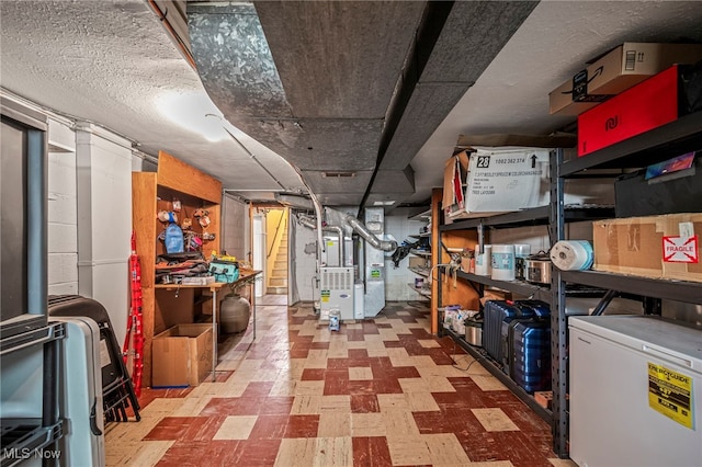 storage room featuring heating unit