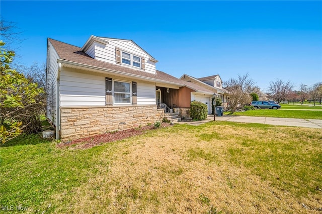 view of front facade featuring a garage, a front yard, stone siding, and concrete driveway