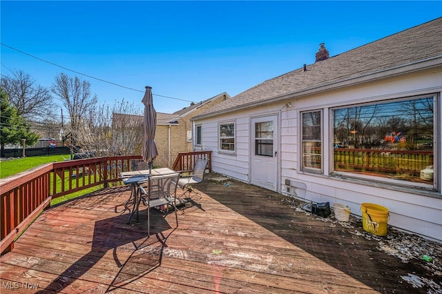 wooden deck featuring outdoor dining area