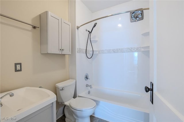 full bath with a sink, toilet, and  shower combination