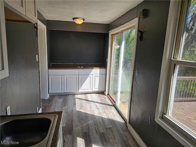 unfurnished dining area with wood finished floors