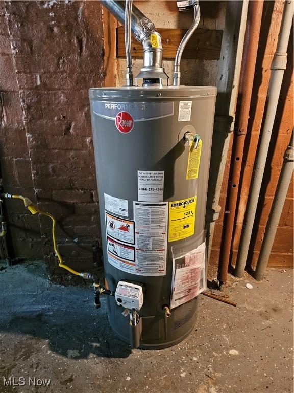 utility room with gas water heater
