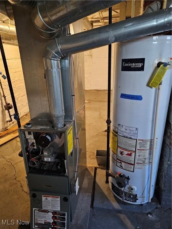utility room featuring gas water heater