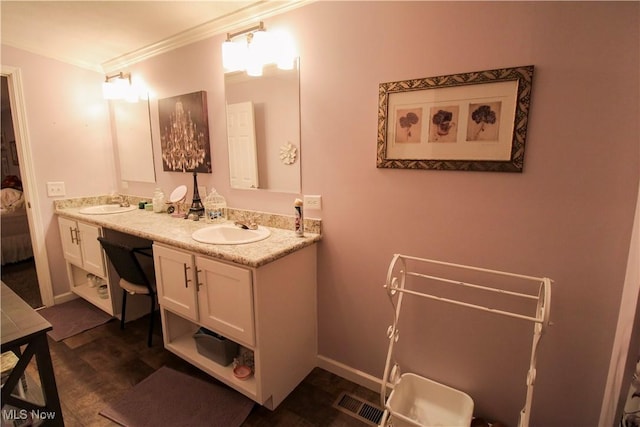 full bathroom featuring double vanity, a sink, visible vents, and ornamental molding