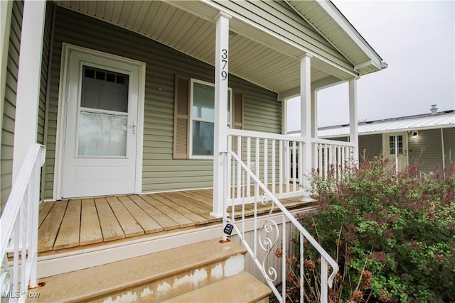 entrance to property featuring a porch