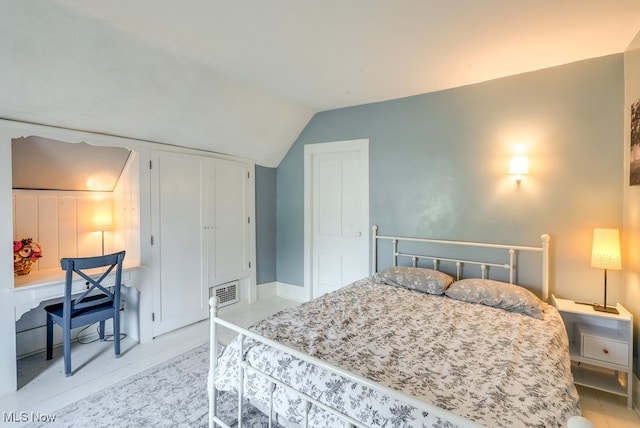 bedroom with lofted ceiling