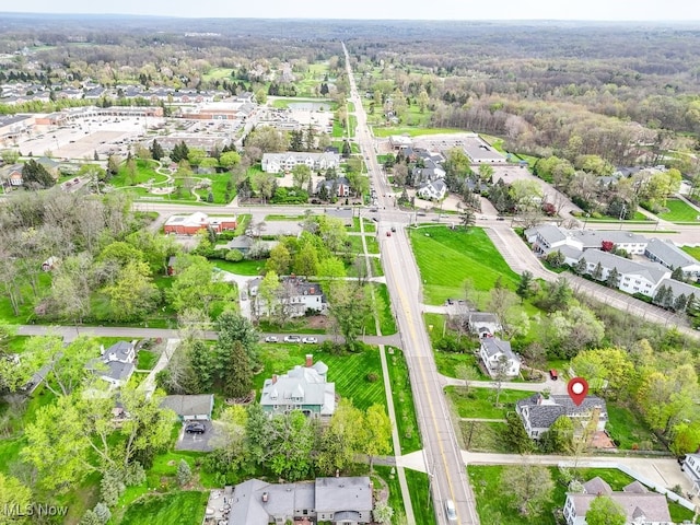 birds eye view of property with a residential view and a wooded view