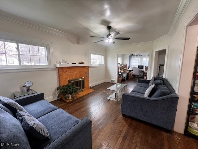 living room featuring crown molding, ceiling fan, and dark wood finished floors