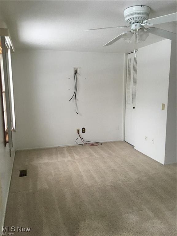 interior space with a ceiling fan