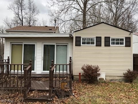 rear view of house with a wooden deck