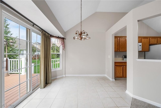 unfurnished dining area featuring an inviting chandelier, baseboards, and lofted ceiling
