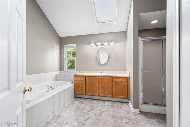 bathroom featuring vanity, a stall shower, a bath, and lofted ceiling