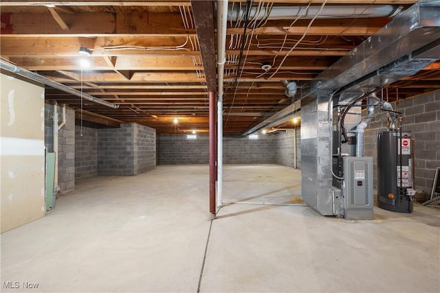 unfinished basement with heating unit and water heater