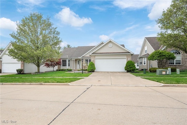 ranch-style house featuring brick siding, a garage, a front lawn, and concrete driveway