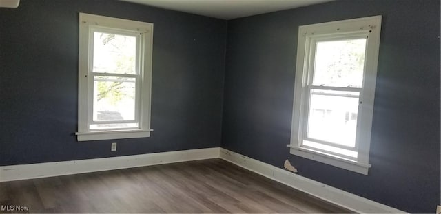 1267 E Pershing St, Salem, OH 44460 - spare room featuring baseboards and dark wood-style floors