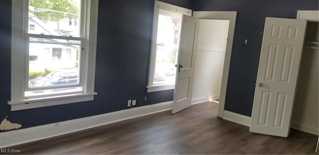 1267 E Pershing St, Salem, OH 44460 - unfurnished room featuring baseboards and dark wood-style flooring