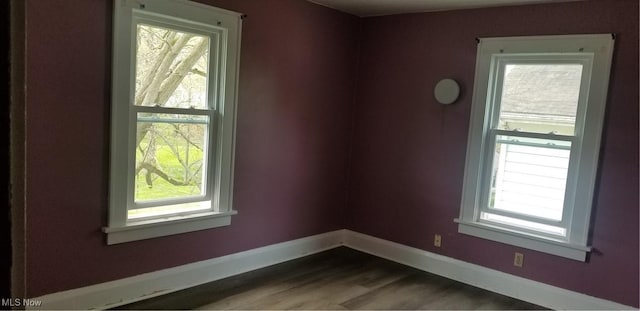 1267 E Pershing St, Salem, OH 44460 - spare room with baseboards and wood finished floors
