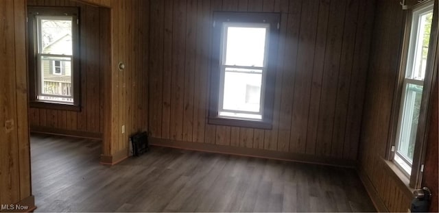 1267 E Pershing St, Salem, OH 44460 - spare room featuring wooden walls, baseboards, and wood finished floors