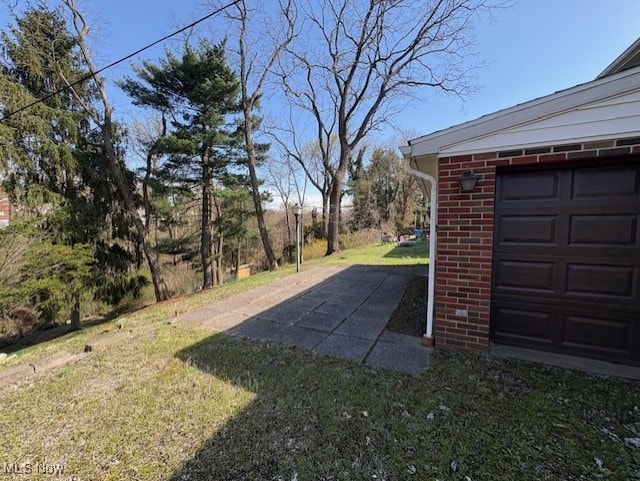 view of yard featuring a garage