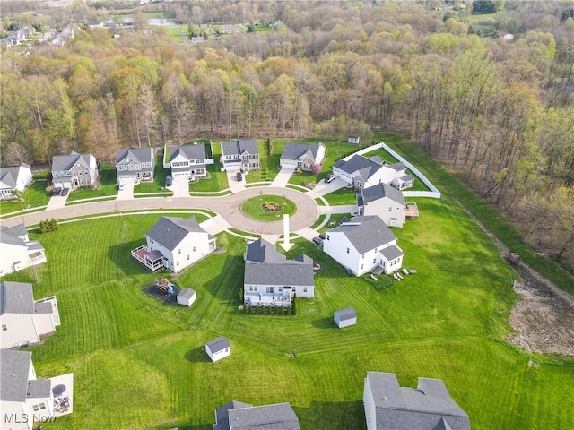 aerial view featuring a residential view and a view of trees