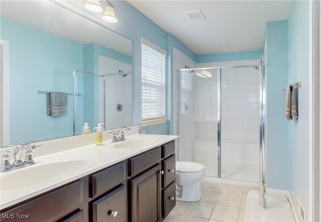 bathroom with a sink, tile patterned flooring, and a shower stall