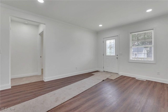 entrance foyer featuring ornamental molding, recessed lighting, and wood finished floors