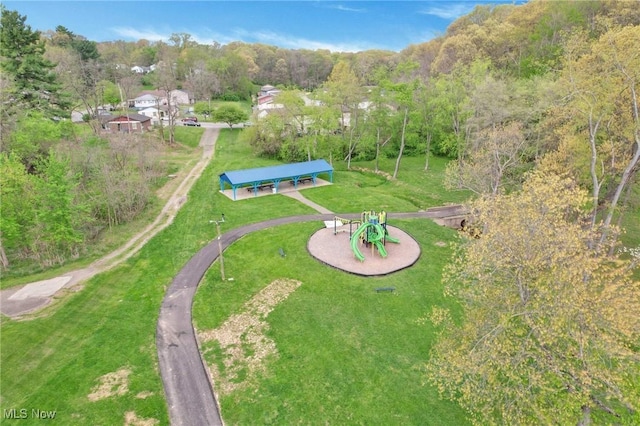 drone / aerial view featuring a forest view