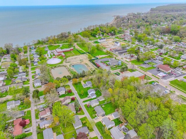 bird's eye view featuring a water view and a residential view
