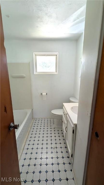 full bath featuring vanity and toilet