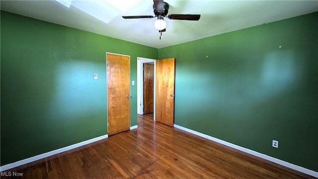 unfurnished bedroom with baseboards, ceiling fan, and wood finished floors