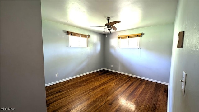 unfurnished room featuring baseboards, a ceiling fan, and wood finished floors