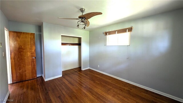 unfurnished bedroom with baseboards, ceiling fan, a closet, and wood finished floors