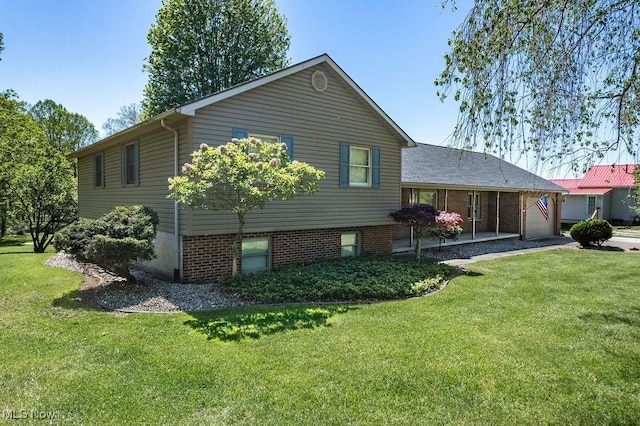 back of house with a yard