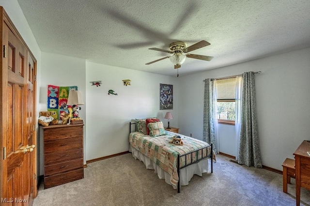 bedroom featuring baseboards, a ceiling fan, and light carpet