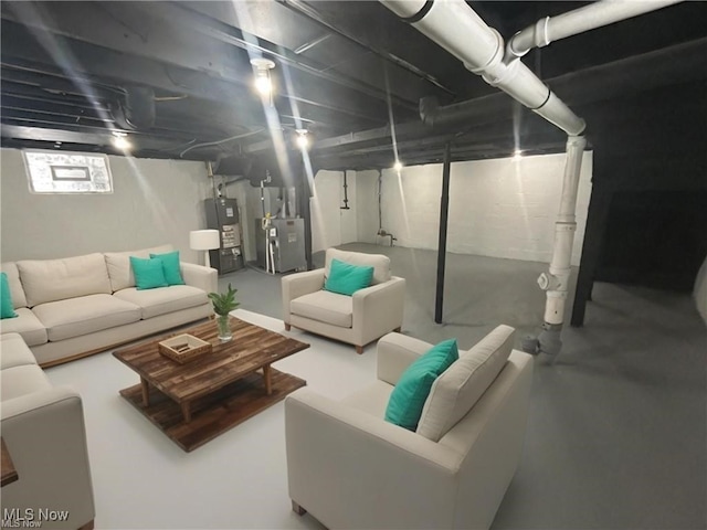 unfinished below grade area featuring heating unit and water heater