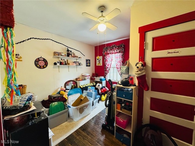 bedroom with ceiling fan and wood finished floors