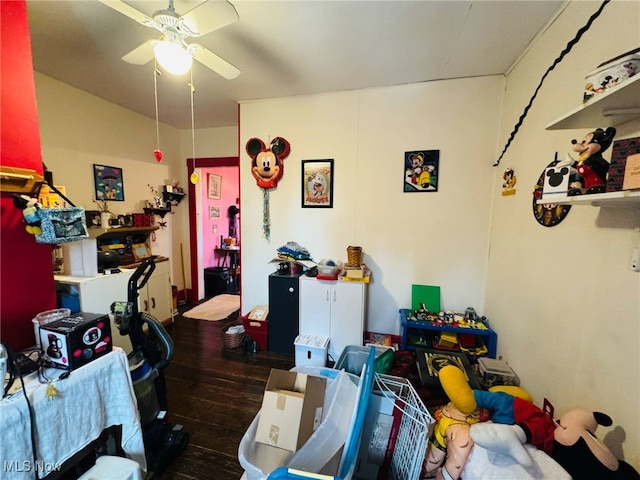 interior space with a ceiling fan and wood finished floors