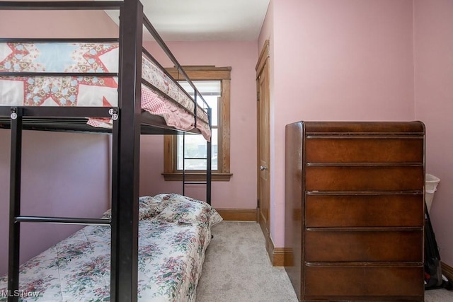 carpeted bedroom with baseboards