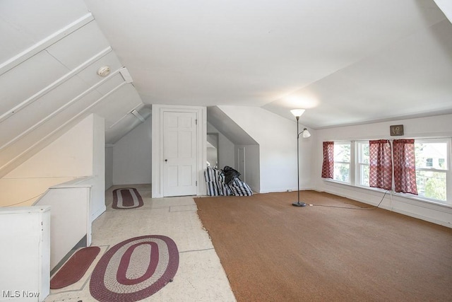 bonus room featuring lofted ceiling